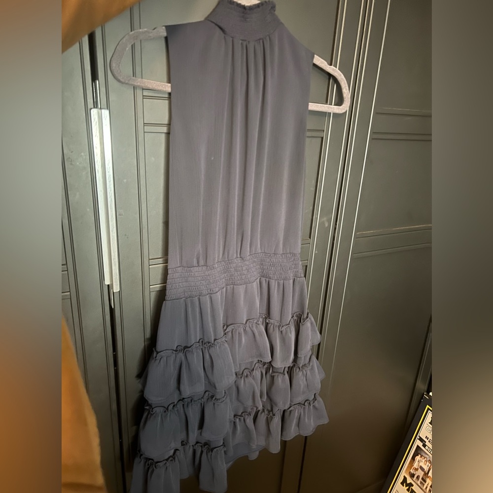 navy blue dress, comes up to the neck.